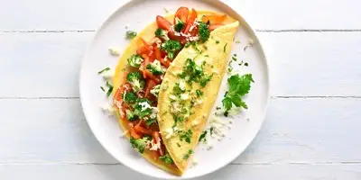 Tortilla con tomate y pimiento