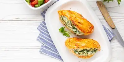 Stuffed turkey escalopes with young leaf spinach and rice