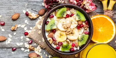Colorful breakfast bowl with pear and tangerine