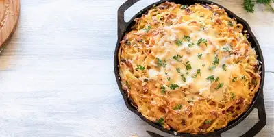 Spaetzle pan with peppers and zucchini